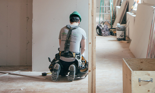 Man doing renovations to a house